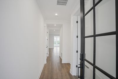 Dedicated foyer entry with full bed and bath off front of home. | Image 2