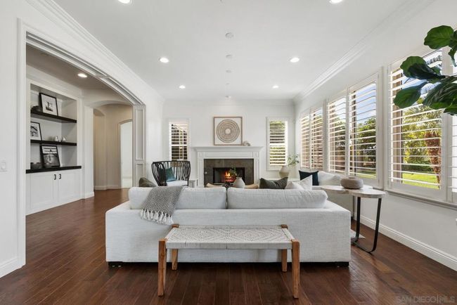 Living room with ample windows bringing in the natural light. | Image 17