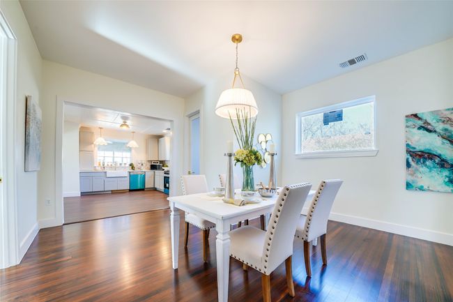Dining area featuring dark wood-type flooring | Image 11