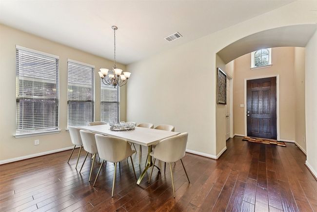 This formal dining room offers the perfect backdrop for everything from holiday meals to casual dinners, with space to comfortably host a crowd | Image 5