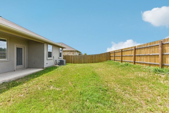 True Backyard Privacy: Backing to protected greenbelt, this fully fenced yard offers peace and space. | Image 20