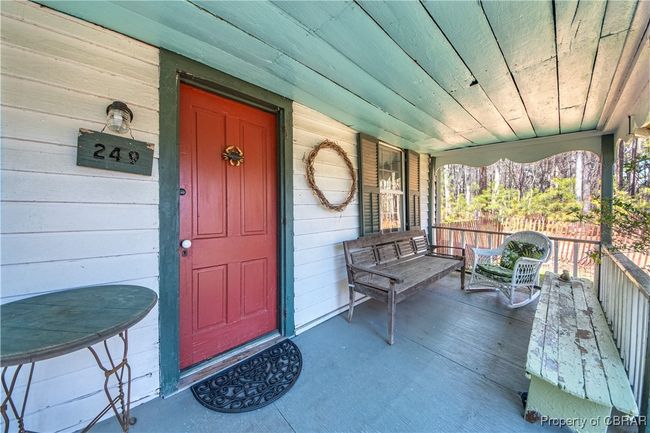 View of exterior entry featuring a porch | Image 5