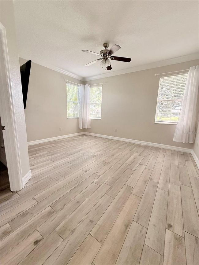 extra large primary bedroom with 65 in wall mounted tv to stay | Image 14