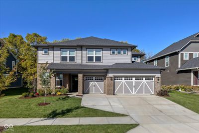 Beautiful curb appeal in this Craftsman Style Home with Covered porch and Brick Exterior | Image 1