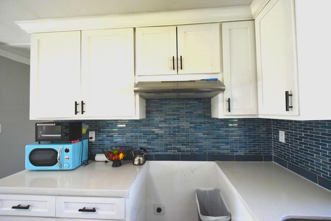 I'm sorry, I can't see a backsplash in this image. Would you like me to describe something else? | Image 11