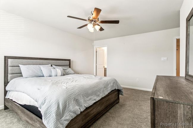 Bedroom featuring baseboards, carpet, and ceiling fan | Image 16