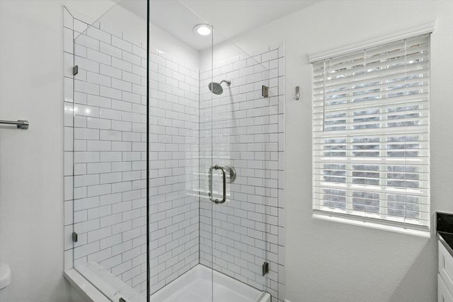 Second level additional primary bathroom featuring a frameless shower stall | Image 22