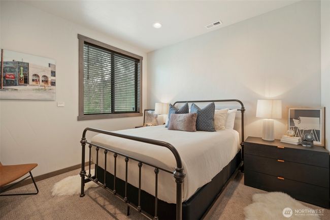 Downstairs bedroom for whoever likes to be away from the "crowd" when they sleep - there's a full bath on this floor as well | Image 22