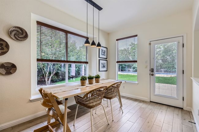 Cozy dining area with backyard views—perfect for everyday meals. | Image 12
