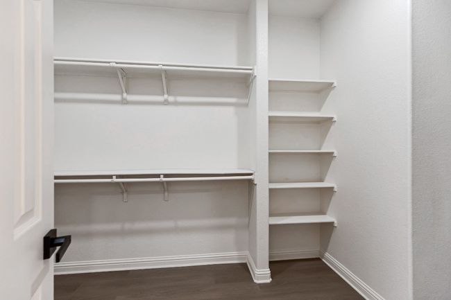 Spacious closet featuring wood finished floors | Image 18