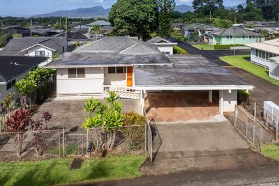 Fence can be removed in front to access the concrete pad for more parking. Perfect for your own pickleball court. | Image 2