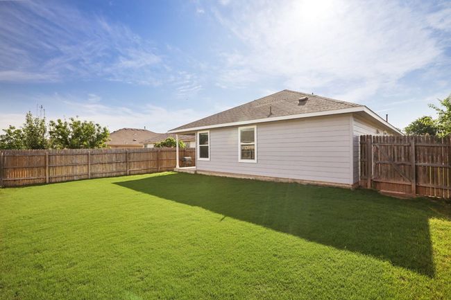 Rear view of house with a fenced backyard | Image 30