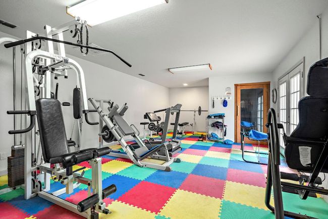 Workout room in pool house. | Image 34