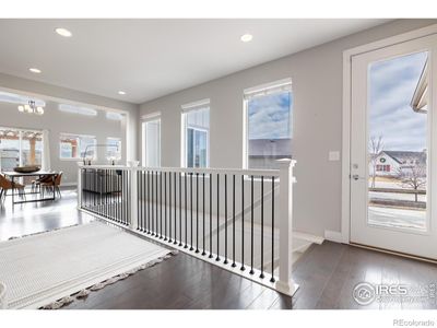 The natural light cascades through these windows as you enter the home. Three windows above the stairwell are remote controlled for comfort an ease. | Image 3