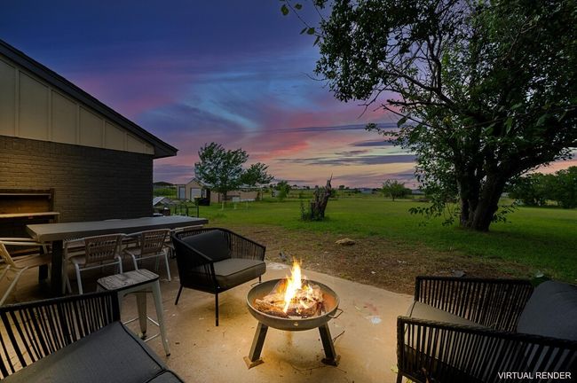 View of patio / terrace featuring an outdoor fire pit and outdoor dining area | Image 5