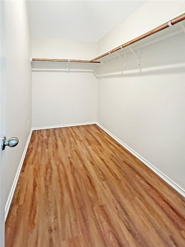 large walk in closet in primary suite | Image 14