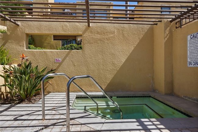 Jacuzzi in pool area to the right of complex | Image 21