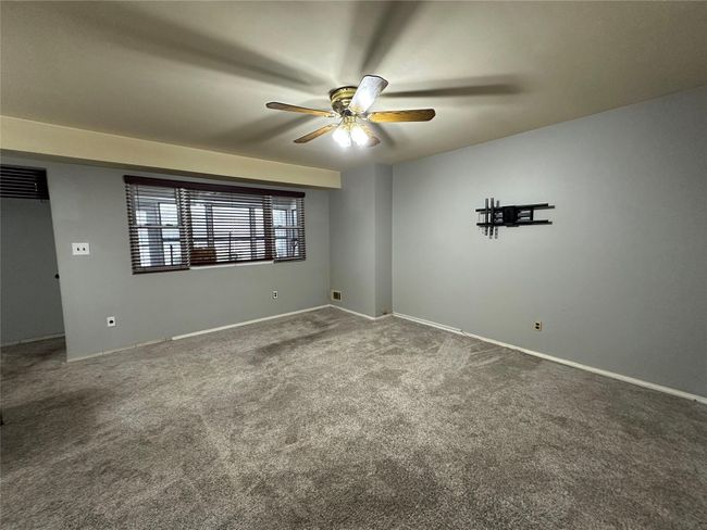Empty room featuring visible vents, carpet, a ceiling fan, and baseboards | Image 8