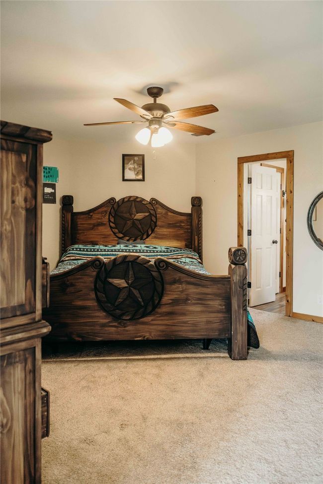 Bedroom with carpet and a ceiling fan | Image 20
