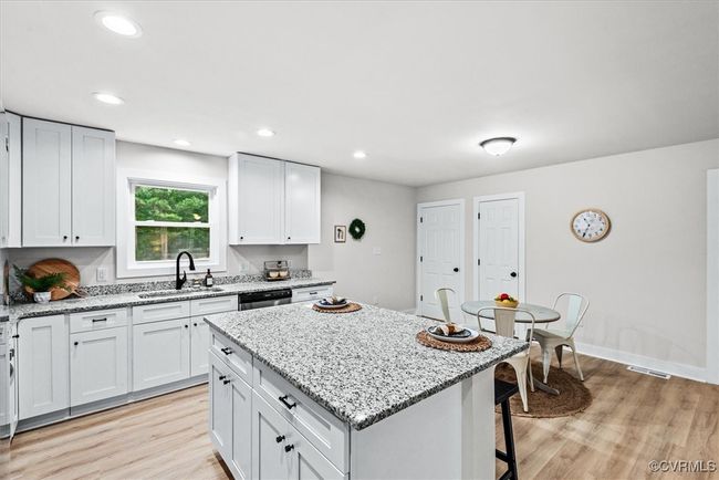 beyond dining is pantry and door to laundry room and porch | Image 10