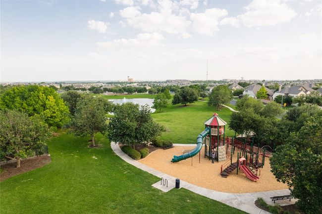 Community play area with a water view and a lawn | Image 28