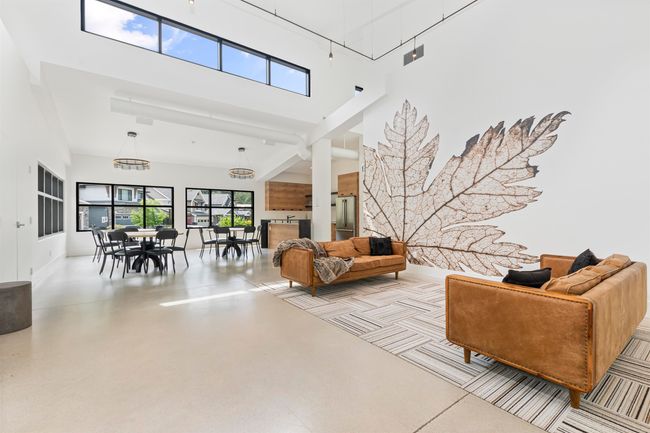 Living room featuring a high ceiling | Image 31