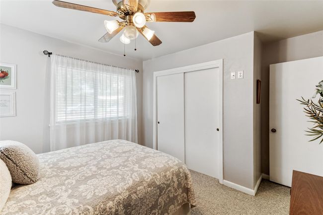 Bedroom #2 (11x11) features a spacious layout with ample natural light, a ceiling fan for added comfort & a good sized closet for storage needs. | Image 14