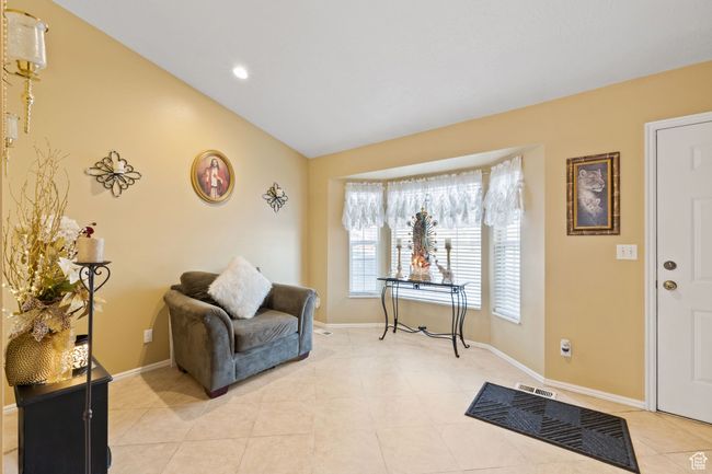 Entrance foyer with lofted ceiling and light tile patterned floors | Image 6