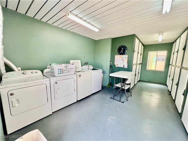 Common laundry room with private storage. | Image 20