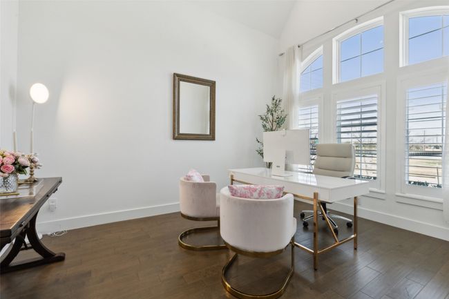 Home office with baseboards, dark wood finished floors, and high vaulted ceiling | Image 4