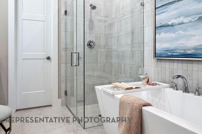 Full bath featuring a stall shower, a bath, and tile patterned floors | Image 21