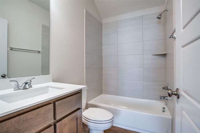 Full bathroom featuring vanity, toilet, and shower / bath combination | Image 19