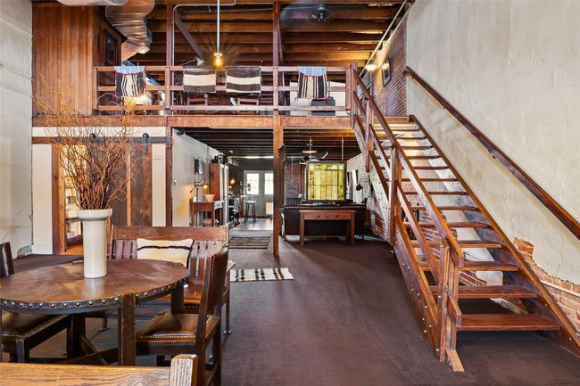 Carpeted dining area featuring stairs | Image 9