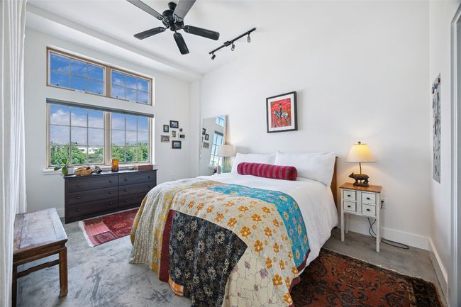 The primary bedroom offers a walk-in closet, full-size washer and dryer, and a private ensuite bath. | Image 13