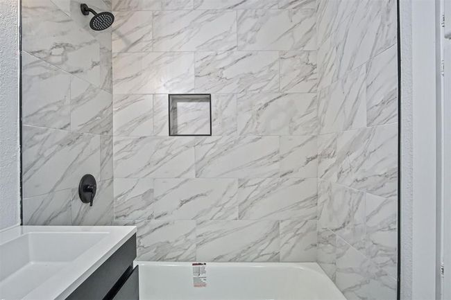 Full bath featuring vanity and bathing tub / shower combination | Image 7