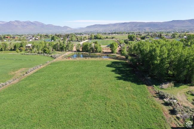 Aerial view of property's location with a mountain backdrop | Image 28