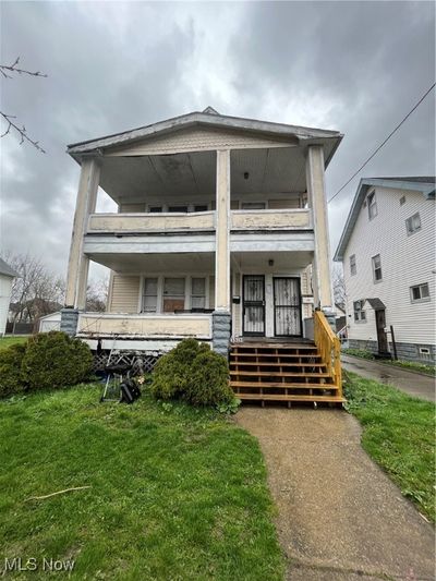 View of front of house with a front yard and covered porch | Image 1