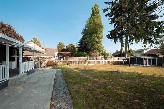 View of fenced backyard | Image 32