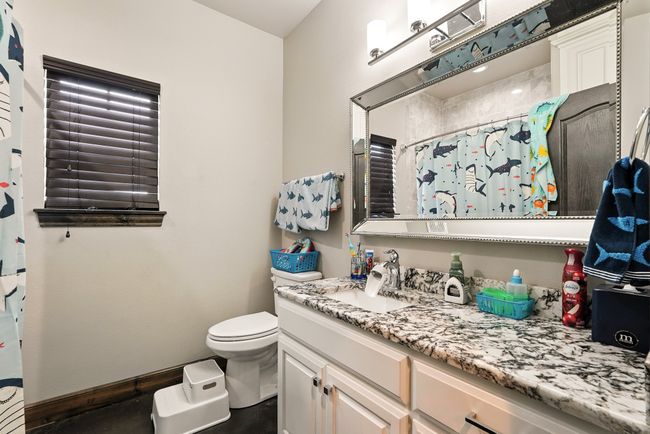 Bathroom featuring vanity and a shower with curtain | Image 24