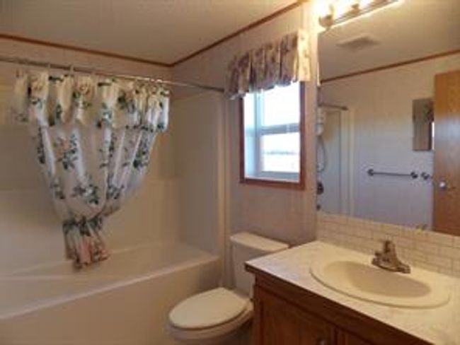 77 - 5210 65 Ave, Home with 3 bedrooms, 2 bathrooms and 3 parking in Olds AB | Image 29