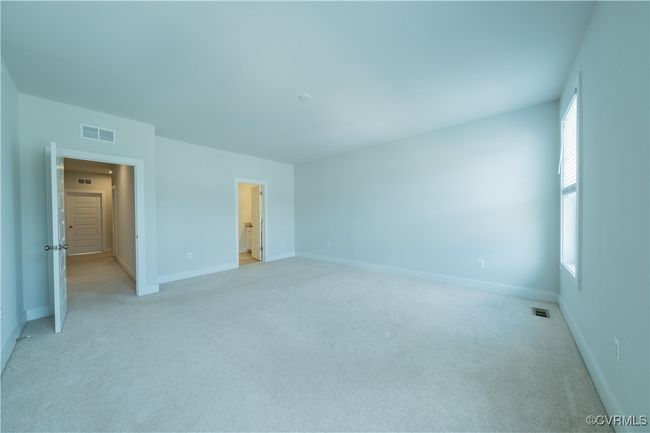 Unfurnished bedroom featuring light colored carpet and baseboards | Image 33