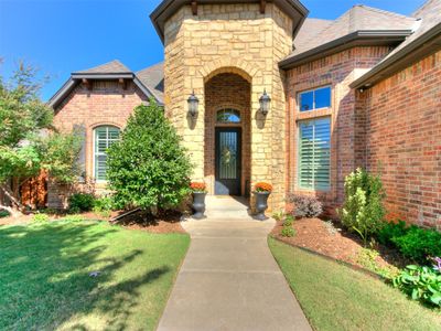 View of exterior entry featuring a lawn | Image 1