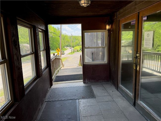 Unfurnished sunroom with plenty of natural light | Image 47