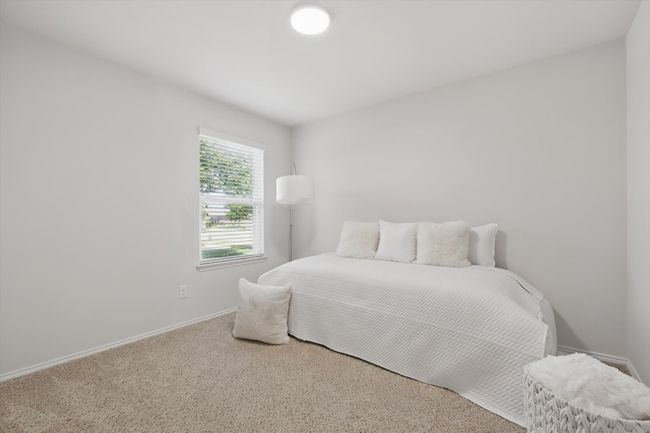 Guest bedroom featuring light carpet | Image 21