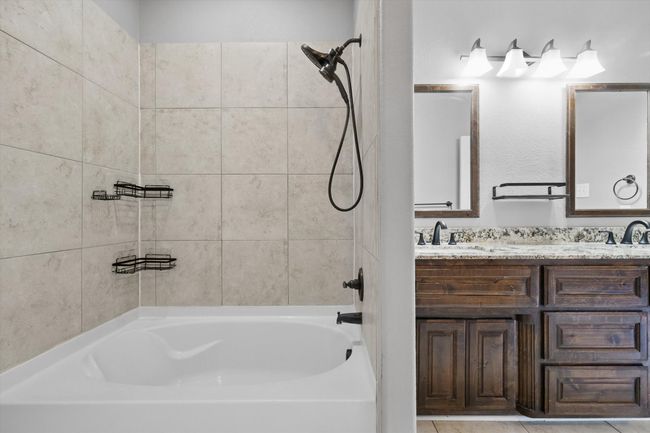 Full bath with bathing tub / shower combination and double vanity | Image 20