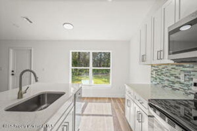 14586 Mocking Wren Rd, House other with 4 bedrooms, 2 bathrooms and null parking in WEEKI WACHEE FL | Image 13
