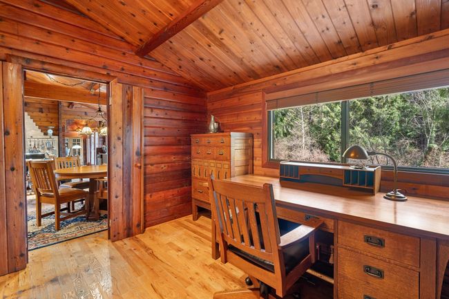 Office space featuring wood finished floors, wooden ceiling, and wood walls | Image 17