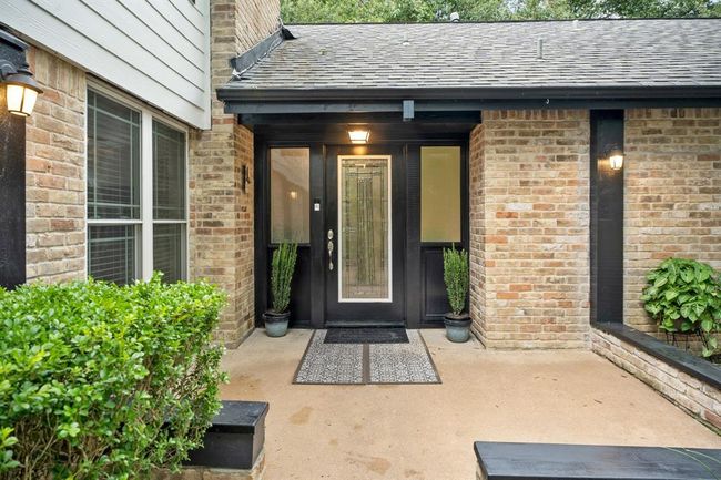 Welcome home! Charming entryway with a sleek front door. | Image 4