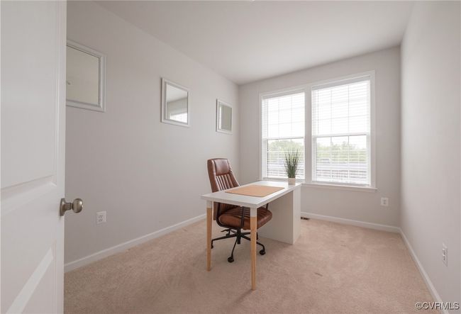 Office area featuring light carpet and baseboards | Image 39