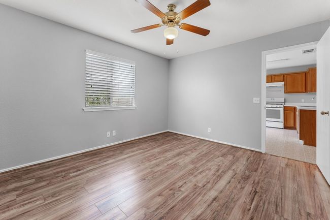 Primary Bedroom featuring light wood-style floors and ceiling fan | Image 15